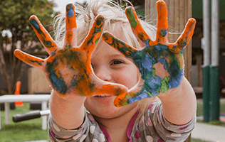 child with painted hands