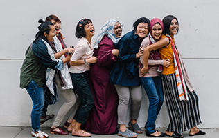 group of women lining up smiling