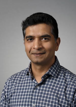 Corporate head shot of Faisal Mukhtar