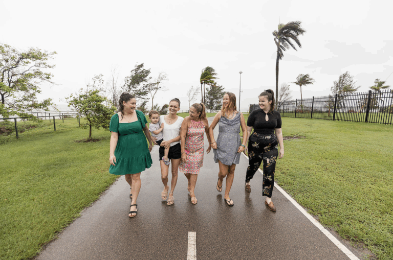 Five women walking along the Darwin foreshore