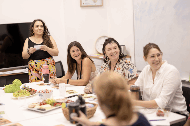 Smiling team members at a meeting